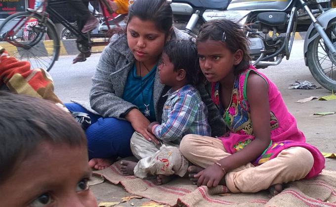 Poor child distributing food