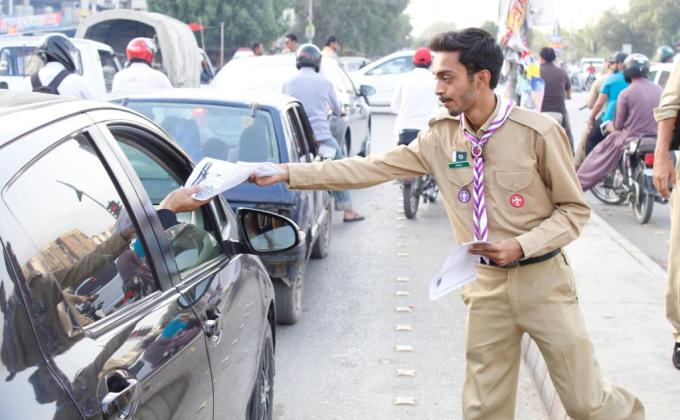 Traffic control and pamphlet distribution regarding traffic rules and scouting