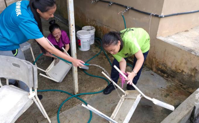 Cleaning and Scrubbing the used Chairs
