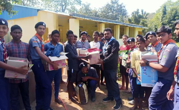 Giving food and cloths to the children