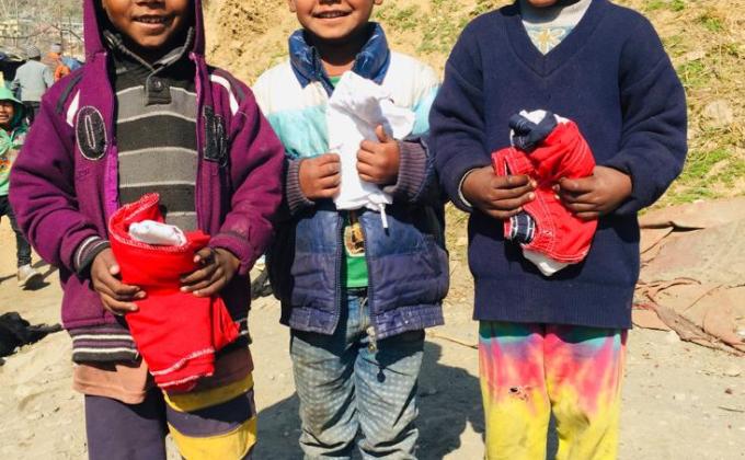 Rovers and Rangers of Kullu College distributed clothes in the slum area