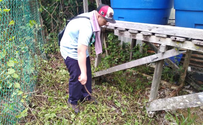 Environmental cleaning in progress at the begining tip of the legendary Borneo Island where Malaysia's lighthouse is situated next to Indonesia's. 