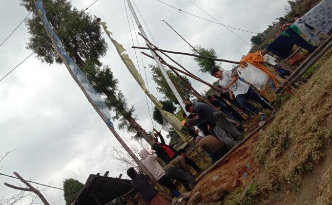 Hoisting prayer flag