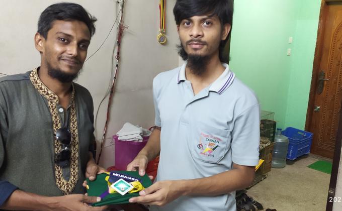 Group scarf and name plate handed over