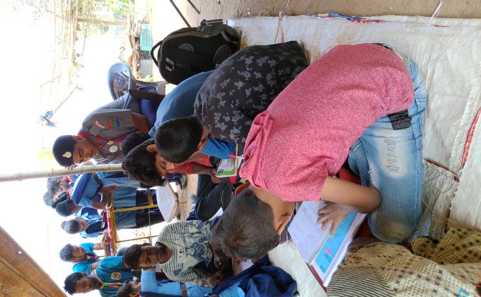 Providing free teaching to slum area children 