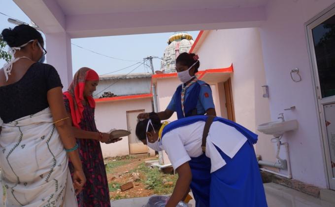 Distribution of cooked food at Bargaon hospital.