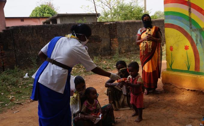 Snacks, biscuits distribution at Mangapada of Telighana village, Block-Kutra