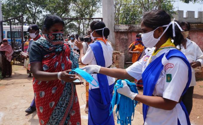 Mask distribution at Hemgir village