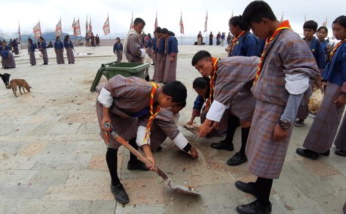 sweeping the ground of Chador Lhakhang