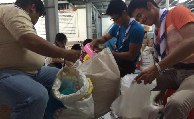 MoPph team brighton venturers helps to re-pack relif goods  