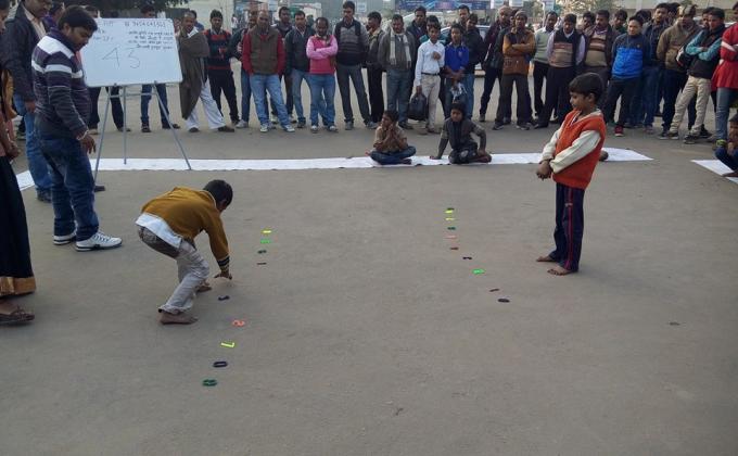 Poor people playing a game
