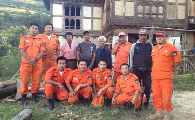 Helping in roofing the house which got blown away by the wind