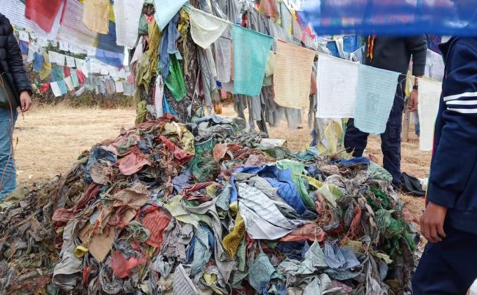 collecting old prayer flags