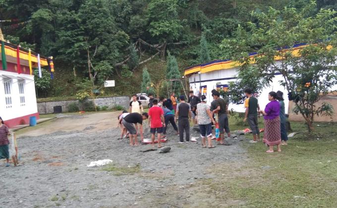 Helping hand in preparation of puja to held in monastery