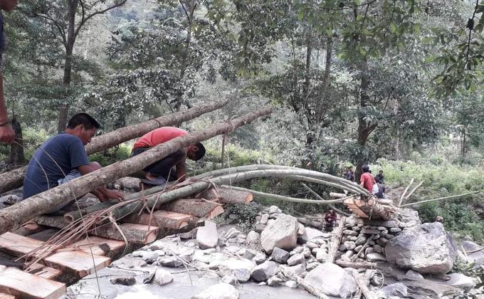 Community Based Scouts build a bridge over Pangkheykhola river 
