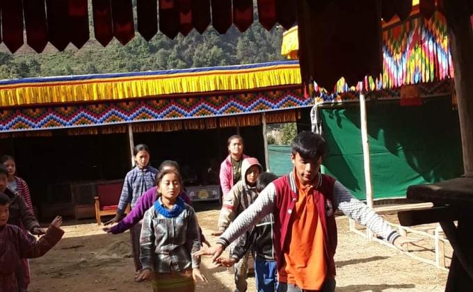 Teaching dance to kids.