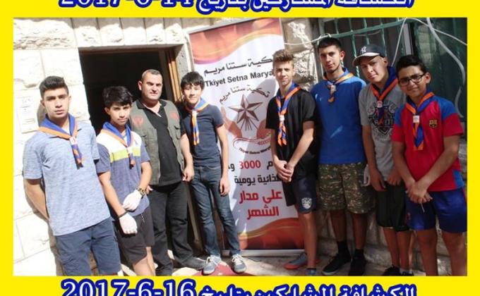 Scout members helping provide food to needy families 