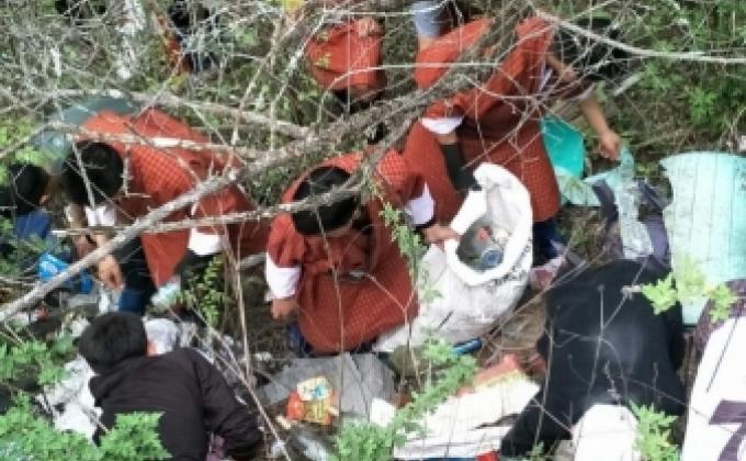 paper picking beside town